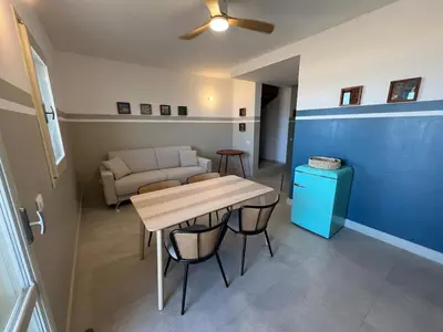 a living room with a table and a couch at Extraordinary sea view in Sal Rei