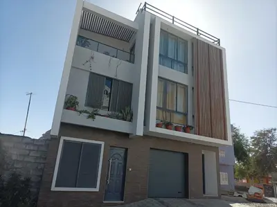 a large house with a balcony on top of it at LBranco in Porto Novo