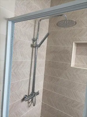 a shower with a glass door in a bathroom at LBranco in Porto Novo