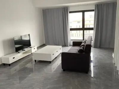 a living room with a couch and a tv at Casa grande aluminum Ida in Sal Rei