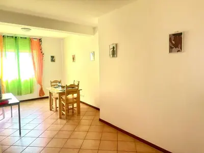a room with a table and a dining room at near the beach On bedroom flat very good in Santa Maria