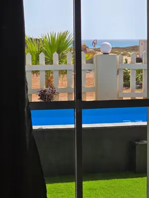 a view of the beach from a window at La Vedetta Bella Vista Ocean View II in Santa Maria