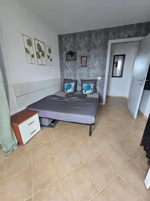 a bedroom with a bed and a tiled floor at La Vedetta Bella Vista Ocean View II in Santa Maria