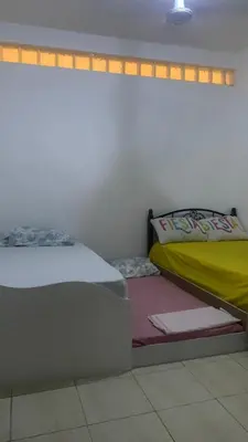 a bedroom with two twin beds in a room at Beach Village Rest in Tarrafal
