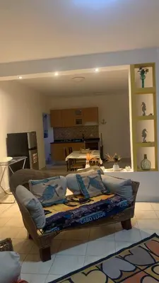 a living room with a couch in the middle of a room at Beach Village Rest in Tarrafal