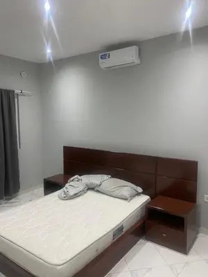 a bed in a room with lights on the ceiling at Ocean view country house in São Filipe