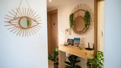 two mirrors on a wall in a room at Sunny & Cosy Flat in Vila Verde near Bikini Beach! in Prainha