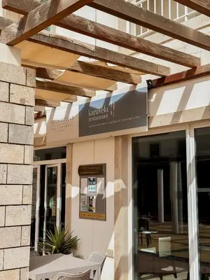 a building with a sign on the side of it at Sunny & Cosy Flat in Vila Verde near Bikini Beach! in Prainha