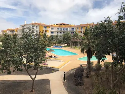 a view of a resort with a swimming pool at Sunny & Cosy Flat in Vila Verde near Bikini Beach! in Prainha