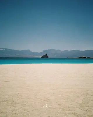 a sandy beach with a view of the ocean at Laginha Apartment in Mindelo