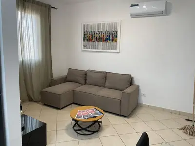 a living room with a couch and a table at Larriba Santa Maria by RPG Group in Santa Maria