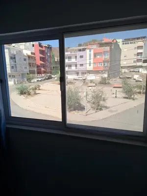 a window in a room with a view of a street at Tdois in Praia