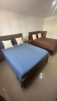 a room with two beds and a couch at Natflor in Praia