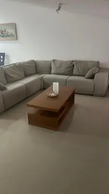 a living room with a couch and a coffee table at Natflor in Praia