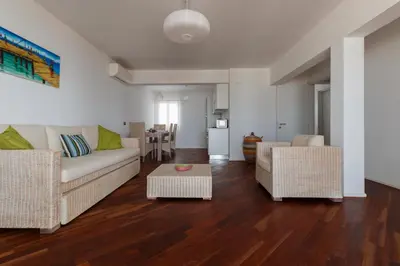 a living room with a couch and two chairs at Villa ao Mar in Santa Maria