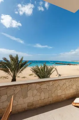 a view of the beach from the balcony of a resort at Villa ao Mar in Santa Maria