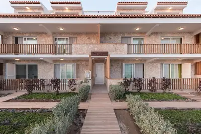 a building with a walkway in front of it at Villa ao Mar in Santa Maria