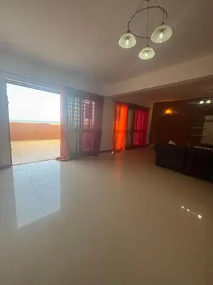 a living room with a couch and a large window at Ocean of View in Mindelo