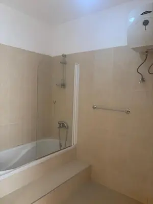 a bathroom with a shower and a tub and a sink at Ocean of View in Mindelo
