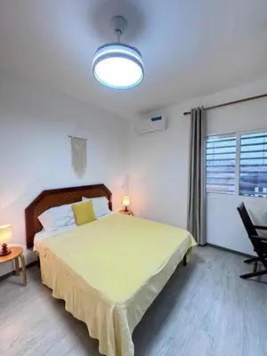 a bedroom with a large bed and a window at Bounty Apartment Santa Maria by RPG Group in Santa Maria