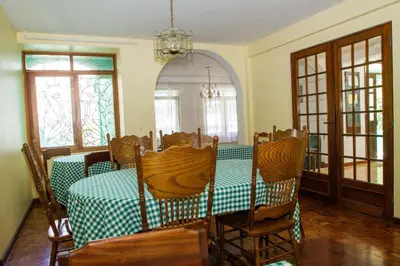 a dining room with a table and chairs at Arla Residential in Mindelo