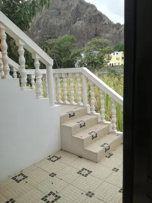 a white staircase with a view of a mountain at Aldeia Jerome in Paul