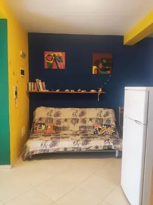 a bedroom with a bed and a blue wall at Ca' Francisca in Santa Maria