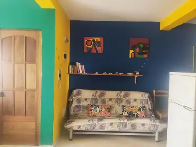 a bedroom with a bed and a blue wall at Ca' Francisca in Santa Maria