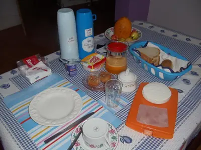 a table with plates of food on a table at Damontanha in Ribeira Grande
