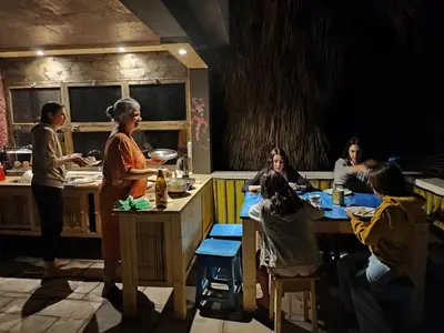 a group of people in a kitchen preparing food at Black Mamba in Paul