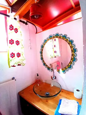 a bathroom with a glass sink and a mirror at Black Mamba in Paul
