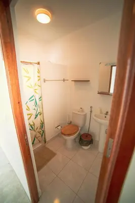 a bathroom with a toilet and a shower at Música do Mar in Ponta do Sol