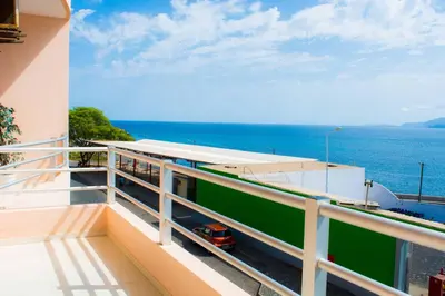 a balcony with a view of the ocean at Restaurante Residencial Nova Cidade in Porto Novo