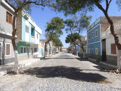 an empty street in a town with trees and buildings at Two bedrooms, WIFI, near beach - Ca Greta in Sal Rei