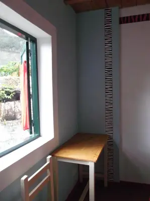 a small table in a room with a window at Misurino in Paul