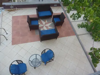 an overhead view of a patio with chairs and tables at Villa Halcyon Caboverde in Cidade Velha