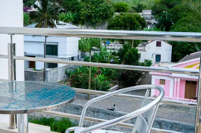 a balcony with a table and a view of a city at Casa Sams in Paul