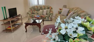 a living room with two couches and a table at Apt. Idilfa in Praia
