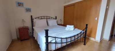 a bedroom with a bed with two towels on it at Apt. Idilfa in Praia