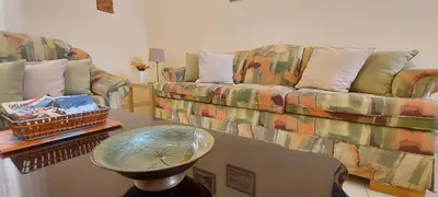 a living room with a couch and a table at Apt. Idilfa in Praia