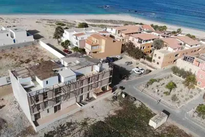 an aerial view of a building on the beach at Ca Madeira - 2bedroom, sea view & wifi in Sal Rei