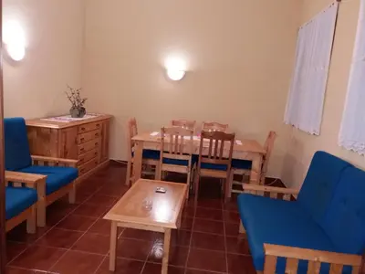 a dining room with a table and chairs at Ribeira Grande Country House in Escabeçada