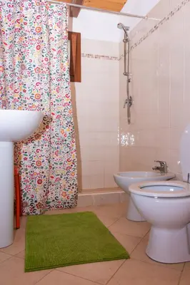 a bathroom with a toilet and a sink and a shower at Aparthotel Ca Bonita in Sal Rei
