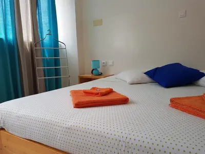 a bed with two towels on top of it at Casa D'Mar in Ponta do Sol