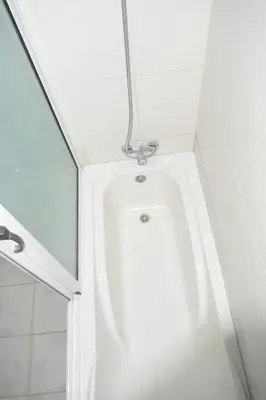 a bathroom with a white urinal in a room at Hotel Miramar Fogo Brava in São Filipe
