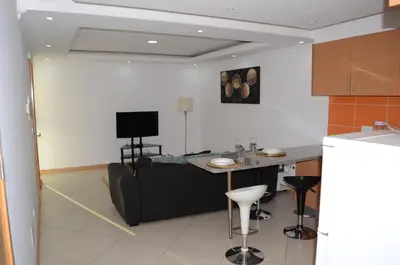 a living room with a couch and a table at Apartamento Rita in Praia