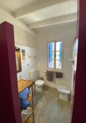 a bathroom with two toilets and a sink at Nos Kasa in Sal Rei