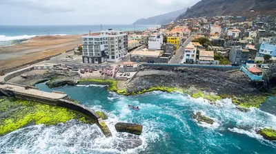 an aerial view of a city and the ocean at Tiduca Hotel in Ponta do Sol
