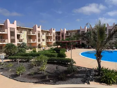 a resort with a swimming pool and a resort at Apartment | in Tropical Resort | pool | close to beach in Santa Maria