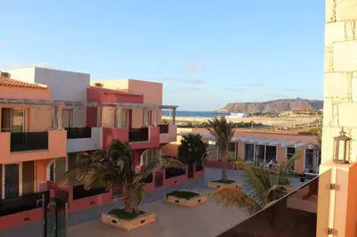 a view of a city with palm trees and buildings at PORT DO SOL-free wi-fi no limits in Sal Rei